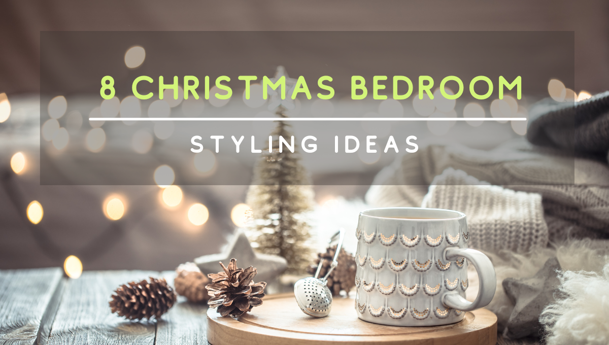 Cozy Christmas bedroom scene with warm lights, holiday decor, and a mug on a bedside table.
