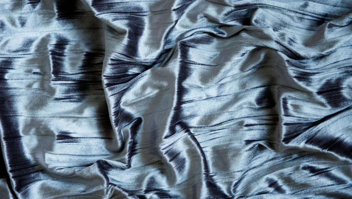 Close-up of breathable cooling sheet fabric texture for hot sleepers.