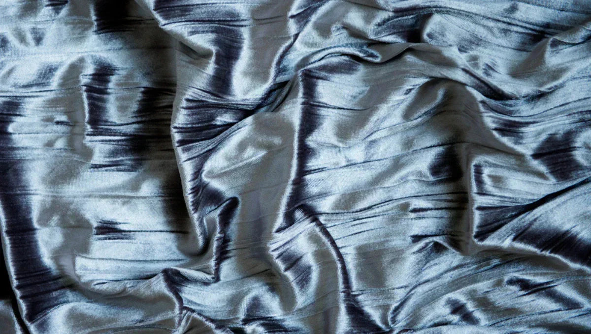 Close-up of breathable cooling sheet fabric texture for hot sleepers.