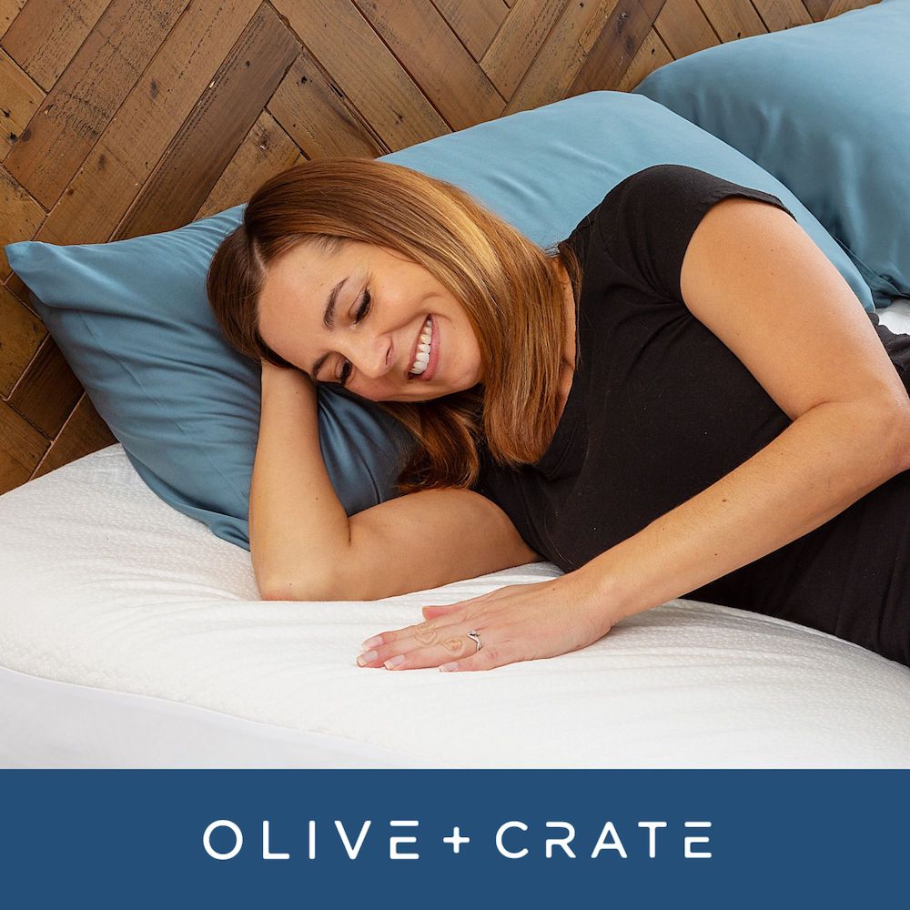 model running hand over mattress pad