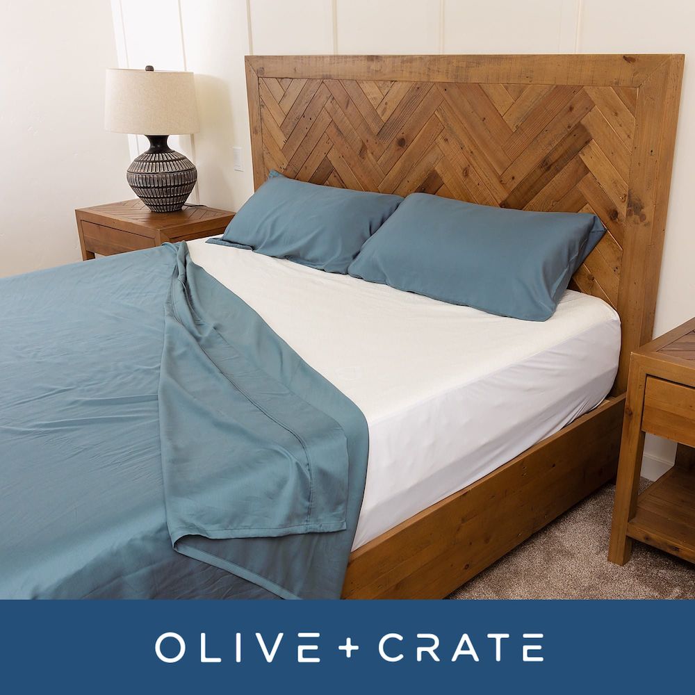 bedroom scene showing mattress protector on bed