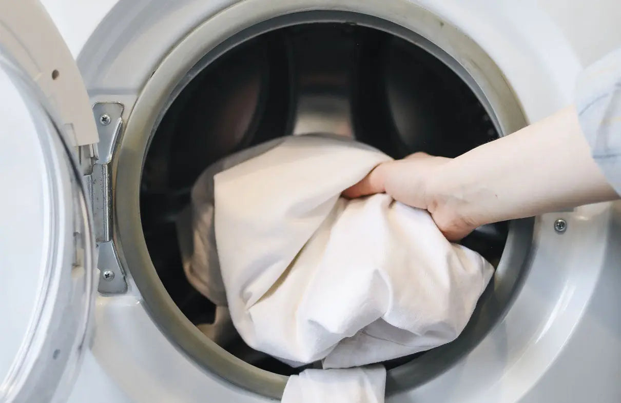 Featured image for Olive + Crate's guide on how to wash mattress protector