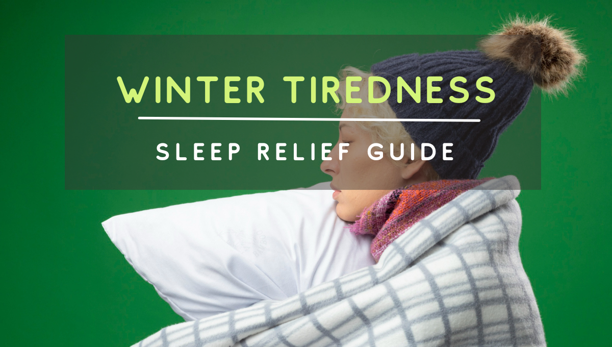 Person bundled in a blanket and winter hat, looking exhausted while holding a pillow, representing winter tiredness and sleep relief.