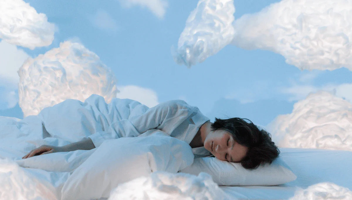 Soft neutral bedroom styled in Cloud Dancer tones with light bedding and a calm, airy design.