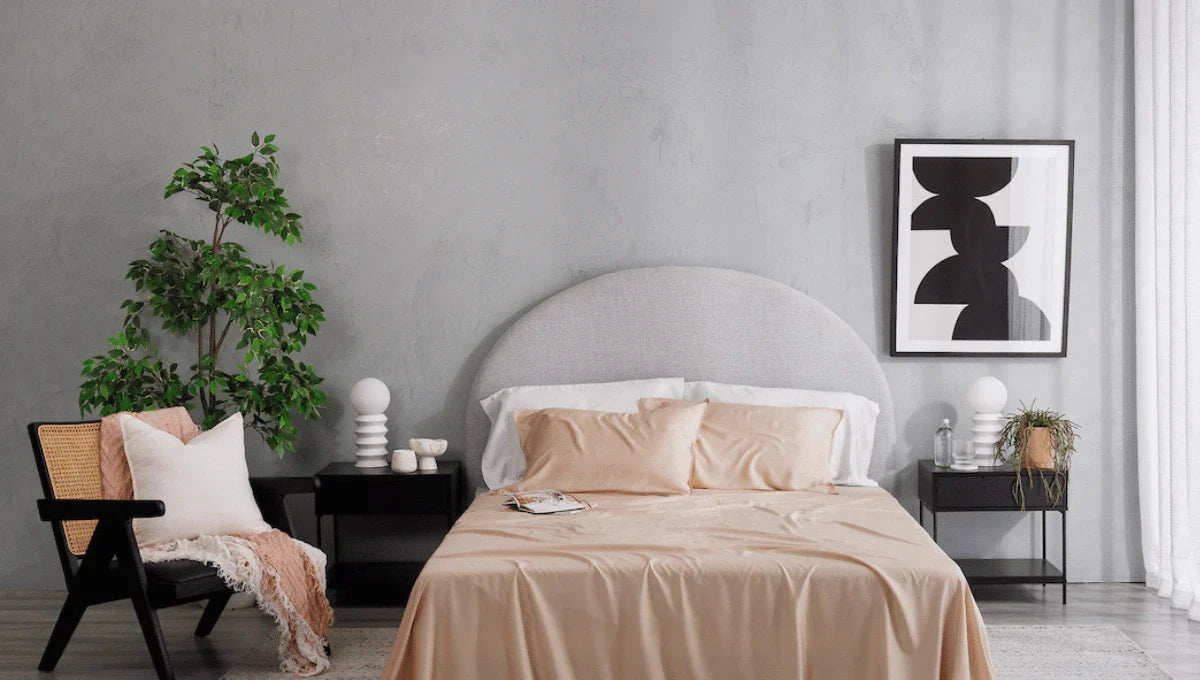 Modern bedroom styled in soft neutral winter tones with smooth bedding, minimalist decor, and a calm, airy feel.