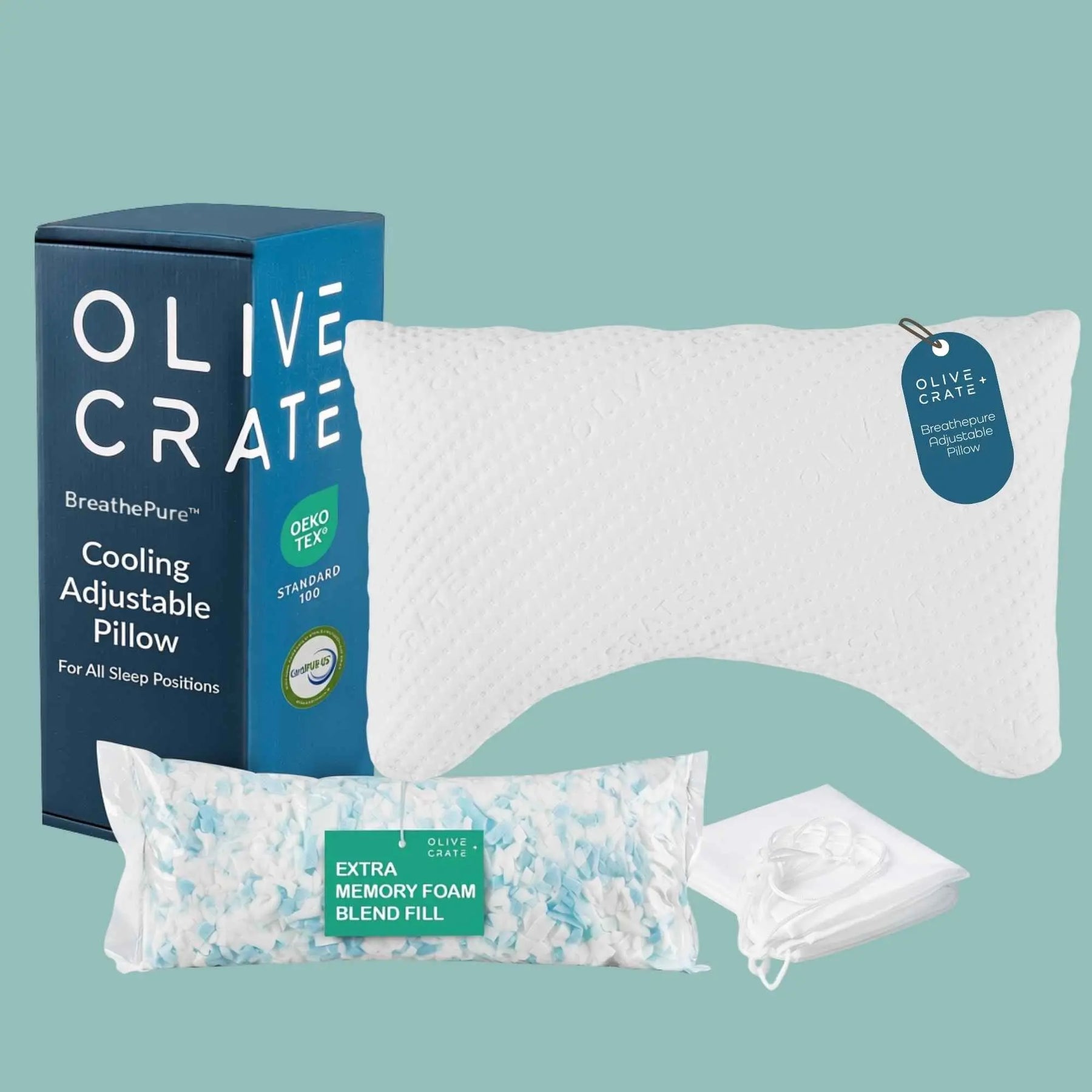 Olive Crated Cooling Adjustable Pillow set on a solid teal background, including the blue and white product box, the white pillow, a bag of memory foam blend fill, and a white drawstring pouch. 