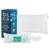 Olive Crate Cooling Adjustable Pillow set including a white textured pillow, blue branded box, packaged extra memory foam blend fill, and a folded white drawstring bag on a white background.Olive and Crate cooling adjustable pillow with packaging on a white background #size_classic