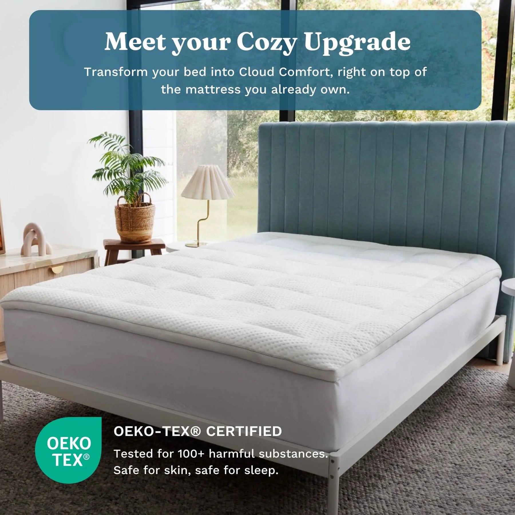A white quilted mattress topper shown on a bed frame in a bright bedroom setting, with a teal upholstered headboard behind it. Text overlays read 'Meet your Cozy Upgrade' and 'Oeko-TEX Certified Tested for 100+ harmful substances. 